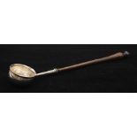 A George I silver Britannia standard circular toddy ladle, turned wooden handle, hallmarked