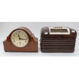 A Bush Bakelite 1950s table-top radio, together with a 1950 wooden mantel clock.