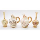 A collection of four early 20th century blush ivory vases and jugs with hand-painted foliage and