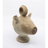 Studio pottery - A 20th century vessel with spouts and handle, swirl decorated to sides, on circular