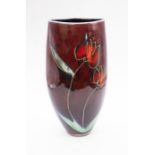 Anita Harris - A tall abstractly formed Tulip designed vase to red background, marked ahs England