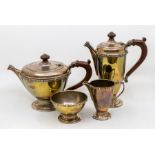 A Modern Celtic Revival four piece silver tea set comprising tea and coffee pot, milk jug and