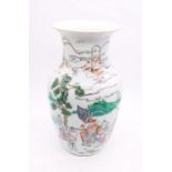 A Chinese vase with seal mark, decorated on a white ground with figures, trees and various scenes