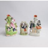 Three Staffordshire figures, a spill holder with a Guardian and angel with children sleeping at