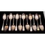 A collection of 19th Century silver table spoons to include: a set of seven fiddle pattern table