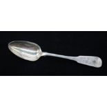A George III Irish silver fiddle pattern table spoon with rat tail, engraved with a crest,