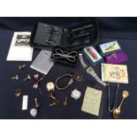 A collection of vintage watches, cufflinks, vanity case, plated wares, badges, stamps, postcards,