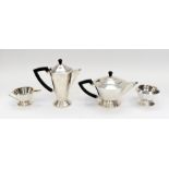 An Art Deco style silver three piece coffee and tea service comprising coffee pot, tea pot and