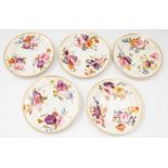 A collection of five early 19th Century Derby hand painted plates with a bouquet detailing gilt