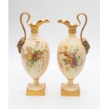 A pair of early 20th century Royal Worcester blush ivory handled ewers on square bases with