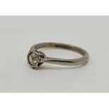 An 18ct. white gold and platinum diamond solitaire ring, set old-cut diamond, size UK O. (gross