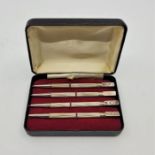 A set of four sterling silver bridge propelling bridge pencils, length 8.7cm, in box, together