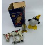 A Tinplate penguin and similar