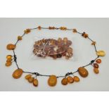 A Russian amber bead necklace, c.1960's, comprised of various opaque and transparent graduated beads