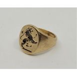A 9ct. gold signet ring, intaglio lion rampant, size UK L. (6.7g)