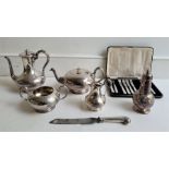 A silver plated four piece tea and coffee service, a silver plated caster and a silver handled