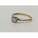 An 18ct. gold and platinum diamond solitaire ring, set round brilliant-cut diamond (EDW 0.50