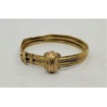 A Victorian Etruscan revival precious yellow metal bracelet, fashioned as a belt and buckle, the