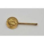 A 9ct gold bar brooch set George V half sovereign, length 50mm, coin obv. engraved. (gross weight