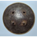 A 19th century Indo-Persian Sipar (shield), of convex circular form with everted brass rim and