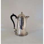 A silver hot water jug, by Martin Hall & Co Ltd, Sheffield 1912, with ebony handle, (gross weight