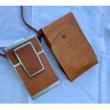 An early Polaroid camera in pigskin case