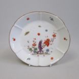 A Meissen yellow ground lobed dish, painted with insects and flowers, Date Circa 1735 blue crossed