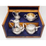 A Victorian Aesthetic silver four piece tea service including tea pot, coffee pot, sugar bowl and