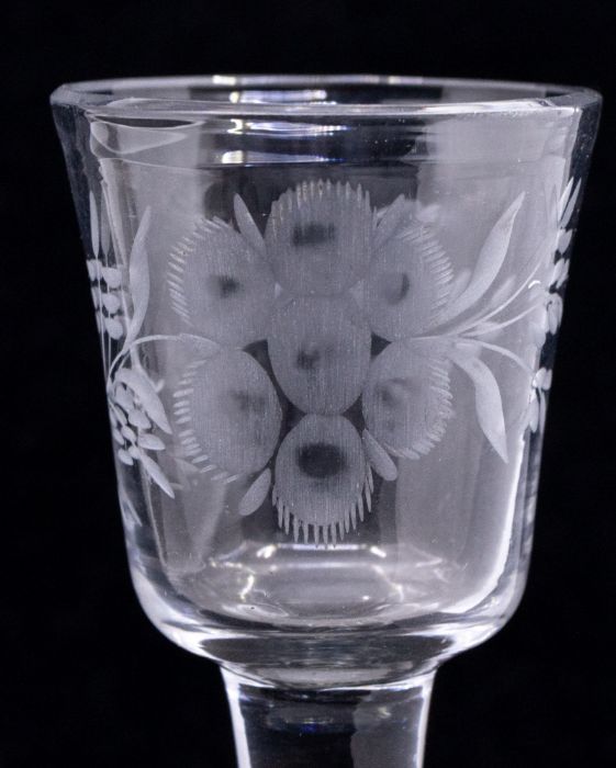 An 18th Century wine glass, the bowl engraved with a perched bird, a large flower and foliage, on - Image 3 of 4