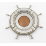 75th Anniversary Windrush: a mid 20th Century white metal ashtray cast as Ship's wheel with