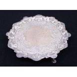 A George III silver card tray, rocaille pie crust rim, with engraved border of scrolling flowers and