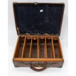 An early 20th Century leather and brass bound cartridge case, fitted interior, each of the six