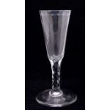 An 18th Century wine or champagne flute, the bowl with a band of etched star and oval cut out