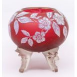 A Stourbridge style ruby cameo glass globe shaped vase, the entire decorated with hedge roses, on