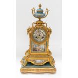 French 8 day gilt metal mantle clock and gilt wood stand. A lovely decorative clock with turquoise