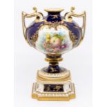 An early 20th Century Royal Worcester two handled vase on stand, bulbous cobalt blue body painted