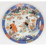 A late 19th Century Japanese Chinese Imari large charger, circa 1900, painted with two Geisha, one