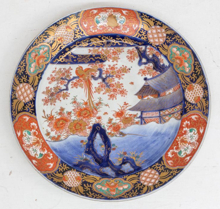 A late 19th Century Japanese Imari large charger, circa 1890, painted with exotic bird in branch