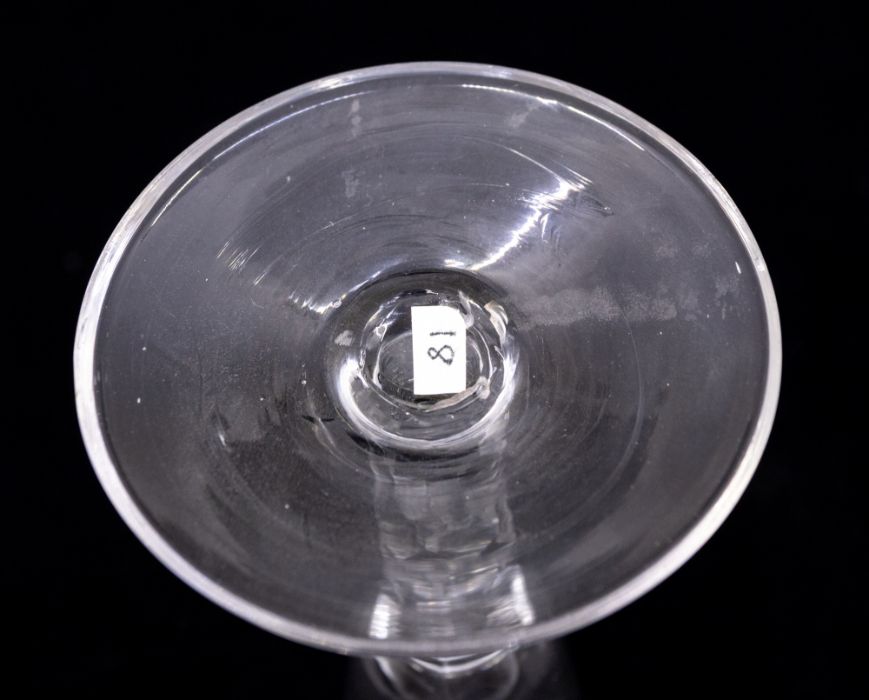 An 18th Century wine or champagne flute, the bowl with a band of etched star and oval cut out - Image 3 of 3