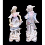 A pair of early 20th Century Continental probably German porcelain figures modelled as 18th