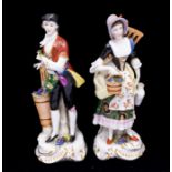 A pair of Samson porcelain figures of Flower Sellers / Gardeners, gold anchor mark to reverse,