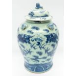 An 18th Century Chinese blue and white large baluster jar and cover, painted with two sky dragons