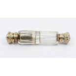 A 19th Century gilt metal mounted double end facet clear cut glass scent bottle, both cover