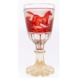 A mid 19th Century large Bohemian ruby and clear glass goblet, the front panel decorated with a