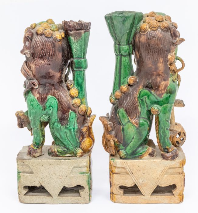 A pair of Chinese egg and spinach glazed Dogs of Fo incense (jos stick) holders, Qing Dynasty ( - Image 2 of 4