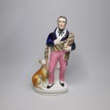 A Staffordshire portrait figure of Sir Walter Scott, with his dog seated at his side. Date circa