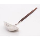 A Modernist silver shaped oval planished (hammered) ladle, with rosewood handle, hallmarked by Keith