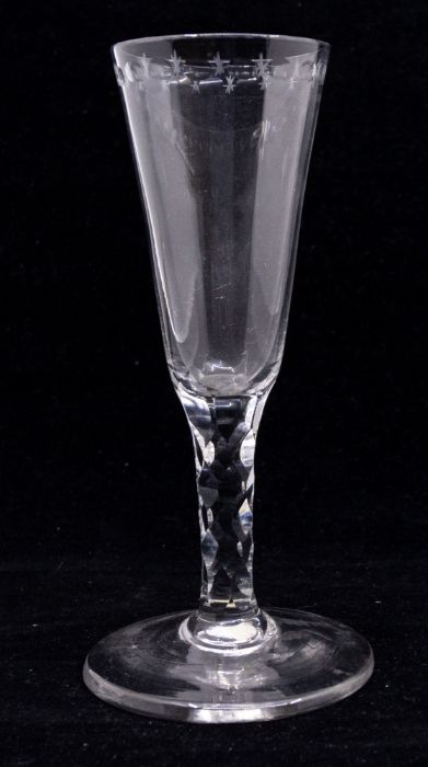 An 18th Century wine or champagne flute, the bowl with a band of etched star and oval cut out - Image 2 of 3