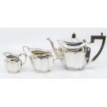 A late Victorian matched three piece silver tea service comprising teapot, sugar bowl and milk
