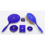 A George V matched silver and cobalt blue guilloche enamel dressing table set to include: mirror,